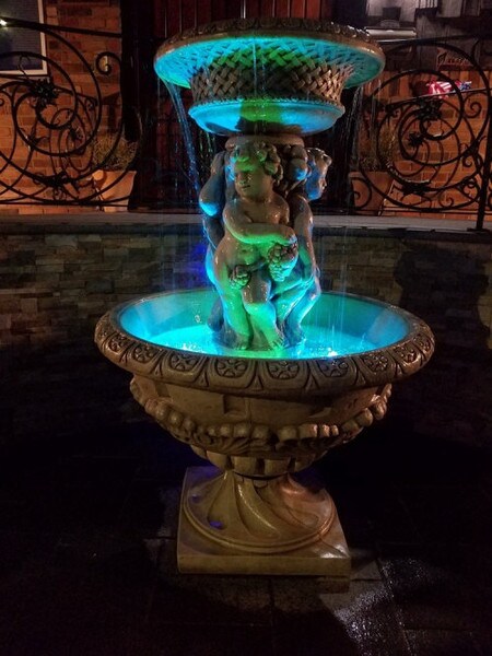 Fountain grapes cherubs cascades striking Henri Renaissance estate